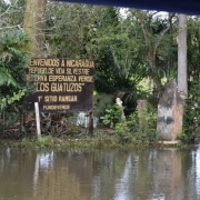 Riverside border sign between Costa Rica and Nicaragua