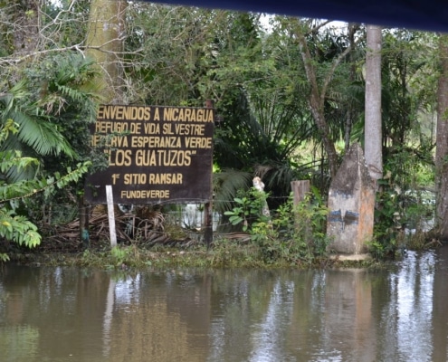 Riverside border sign between Costa Rica and Nicaragua