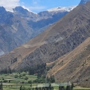 Tourists stroll through beautiful landscapes while enjoying the very best places to visit in Peru.