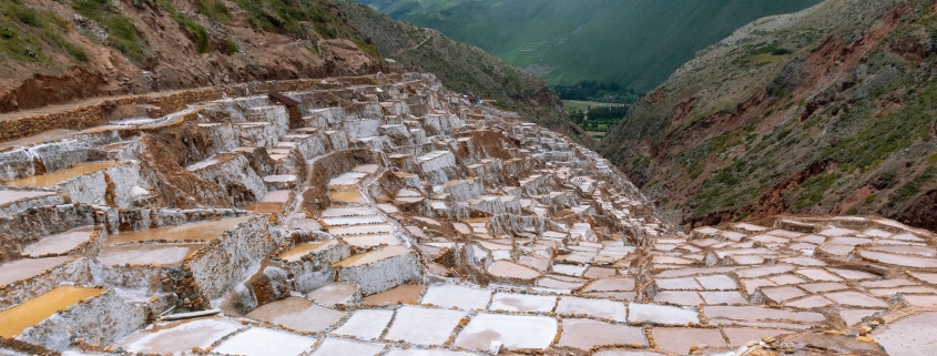 A group of tourists takes in the scenic views while enjoying Peru tours offered by Caravan.