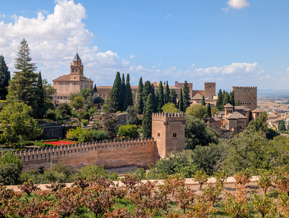 The Alhambra palace complex overlooking Granada, Spain with the Sierra Nevada mountains in the background