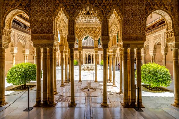 The Court of the Lions in the Alhambra featuring the marble fountain surrounded by slender columns and arches