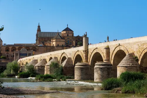 The Roman Bridge crossing the Guadalquivir River with the Mosque-Cathedral of Cordoba in the background